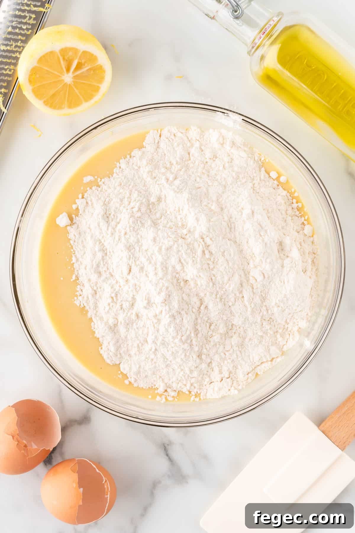adding the dry ingredients to the wet ingredients