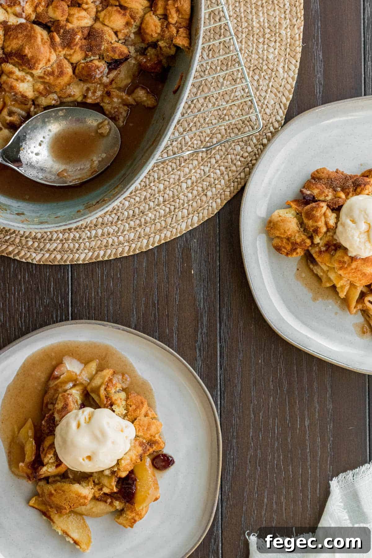 2 plates of apple crisp with ice cream