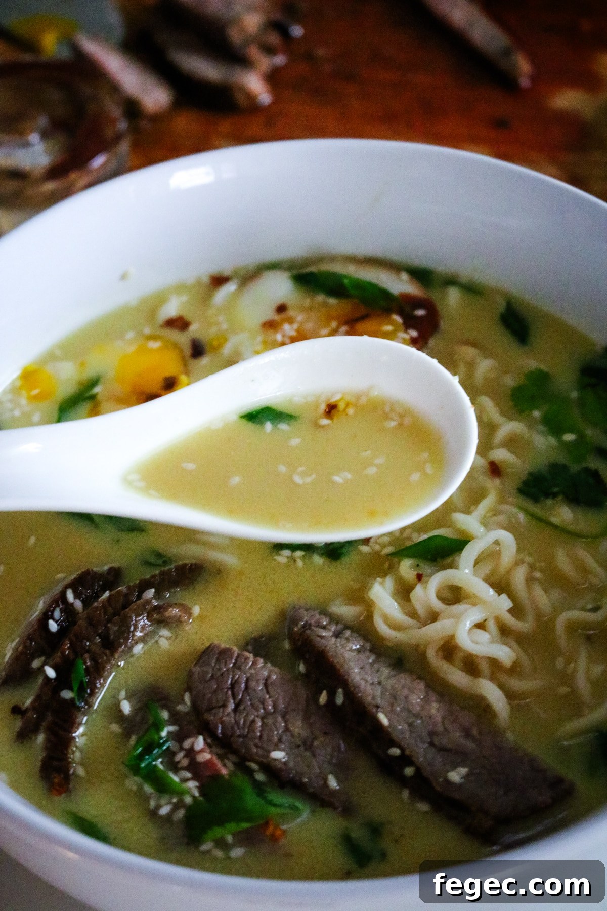 creamy steak ramen with noodles and greens.