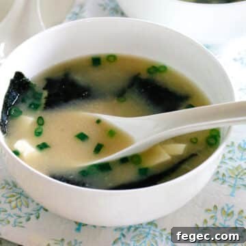Warm miso soup with seaweed and tofu served in a simple ceramic bowl.
