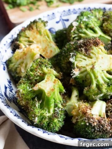 Air fryer broccoli parmesan in a bowl.