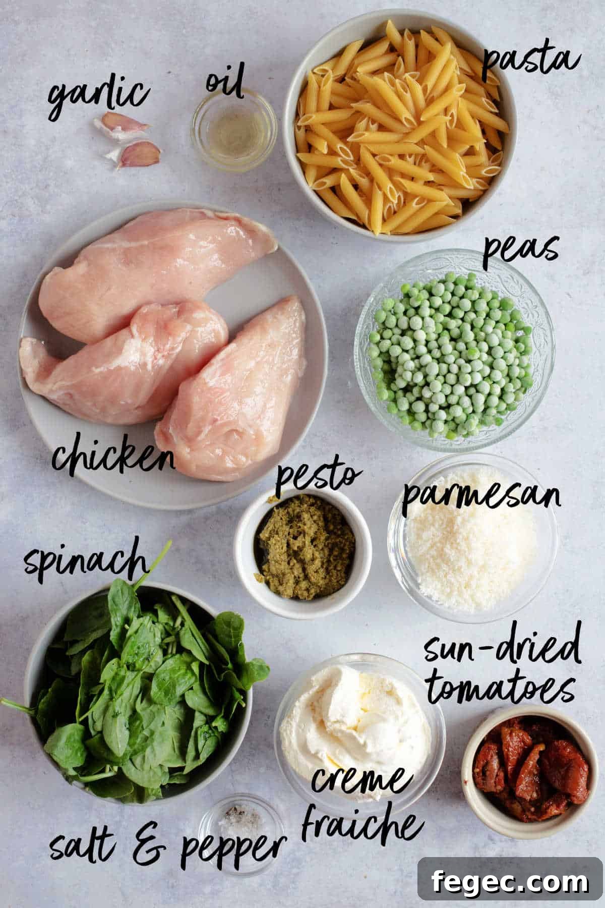 Ingredients for creamy pesto chicken pasta.
