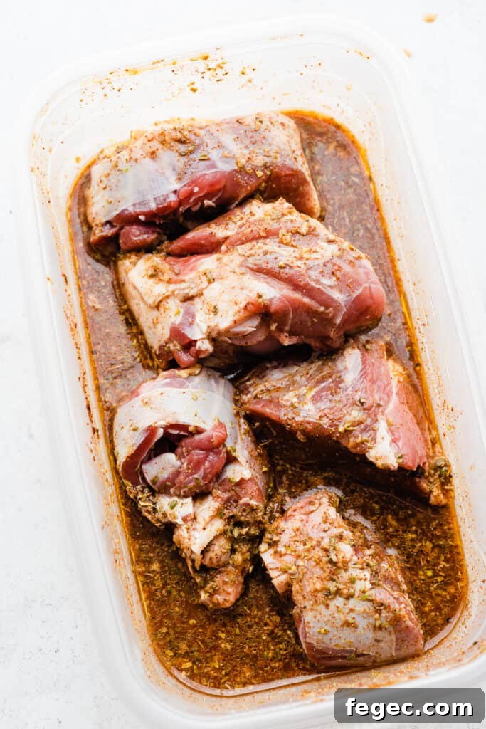 A tupperware with the lamb marinating. 