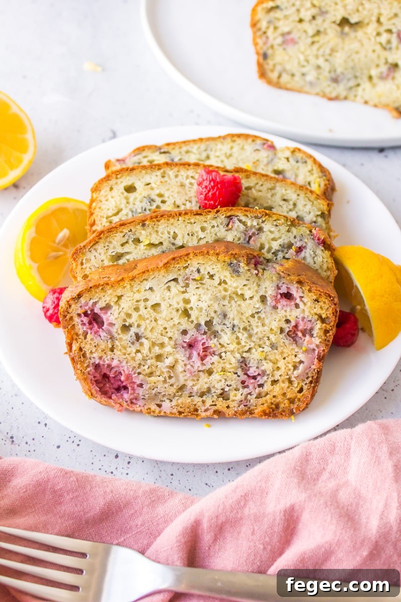 slices of raspberry lemon loaf on a plate