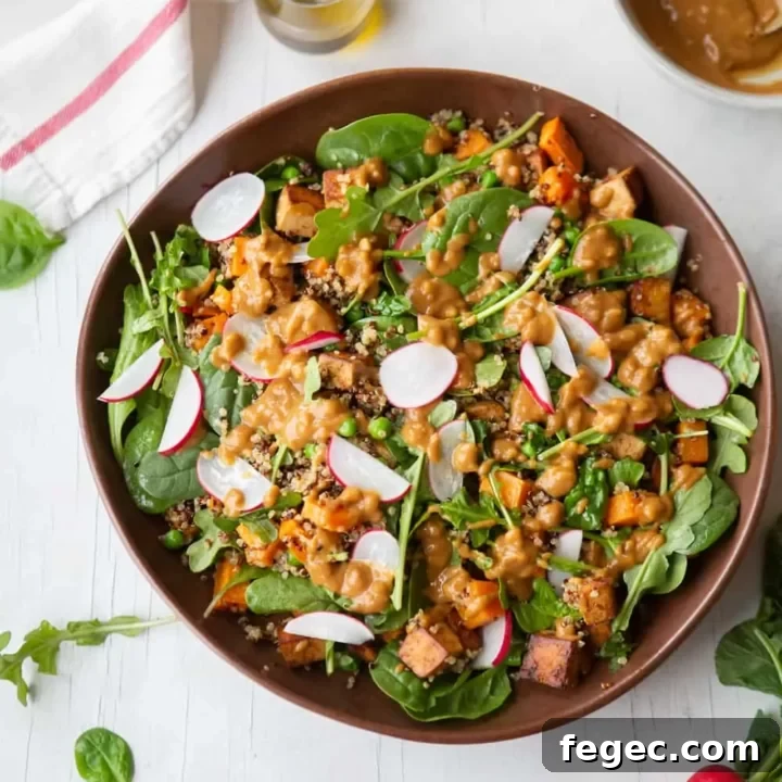 High-protein vegan dinner salad featuring quinoa, tofu and sweet potato.