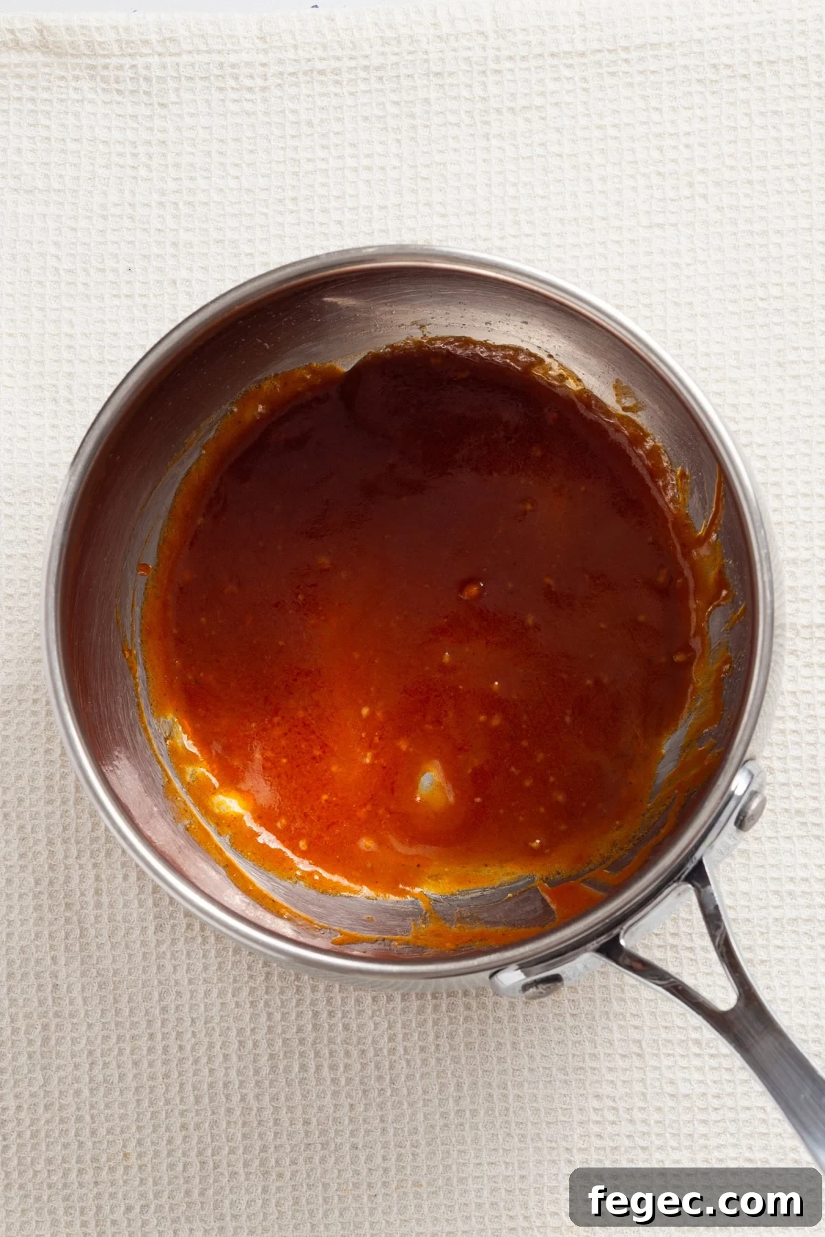 An overhead image of the buffalo sauce on a pot.