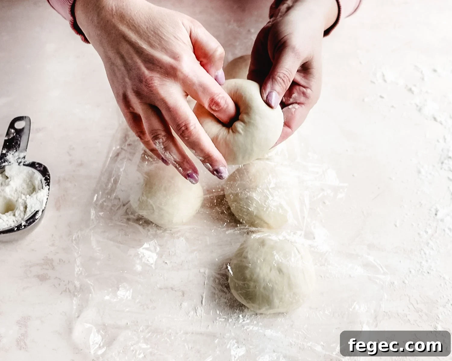 Homemade Onion Bagels: Authentic Recipe Ready in 3 Hours 11 Poke a hole through the center of each ball of bagel dough.