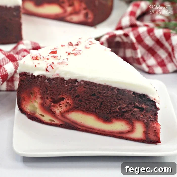 Candy Cane Cheesecake Cake is a fun holiday dessert recipe with a layer of moist Red Velvet cake, a layer of cheesecake and topped with a homemade cream cheese frosting.