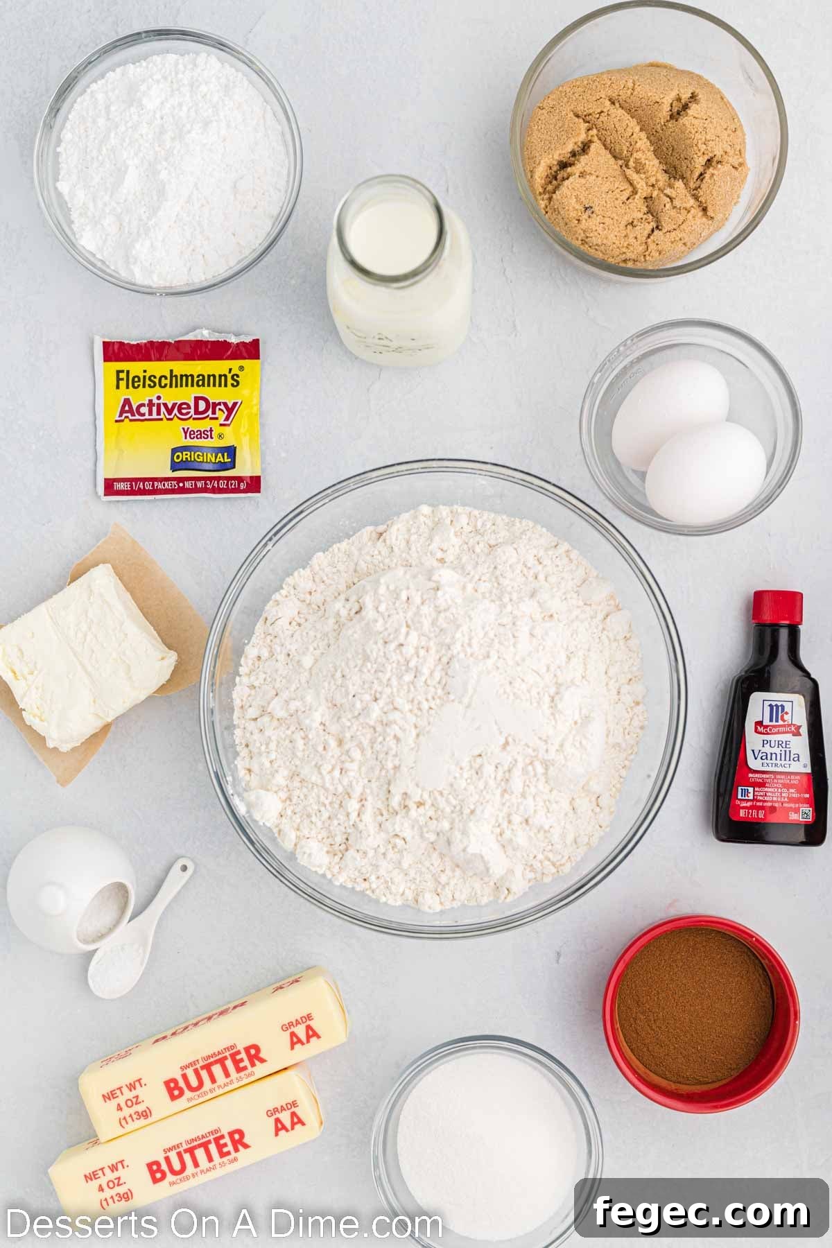 Ingredients for Cinnabon Cinnamon Rolls - warm milk, yeast, butter, eggs, flour, brown sugar, cinnamon butter, cream cheese, powdered sugar, vanilla.