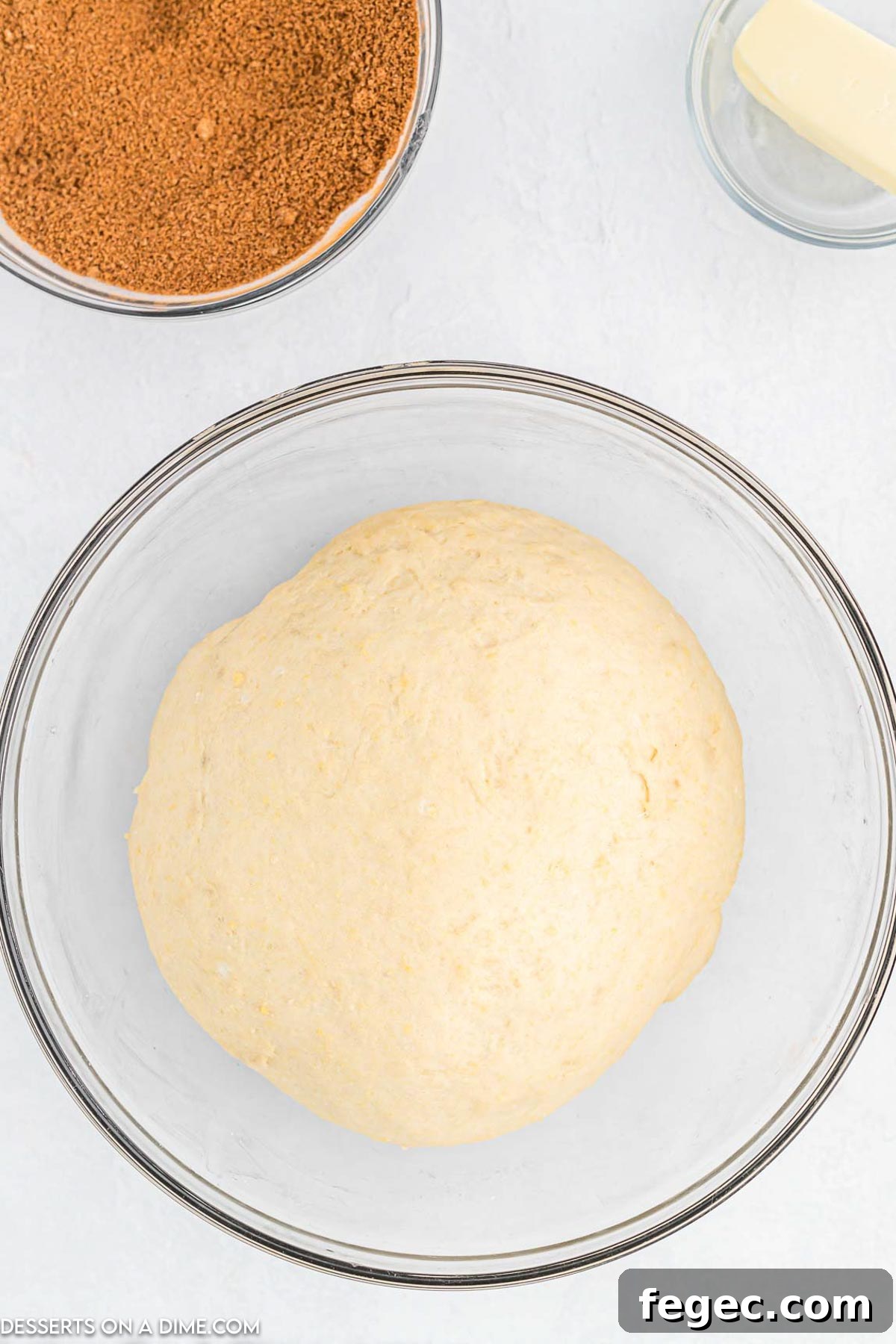 Dough in a mixing bowl rising.