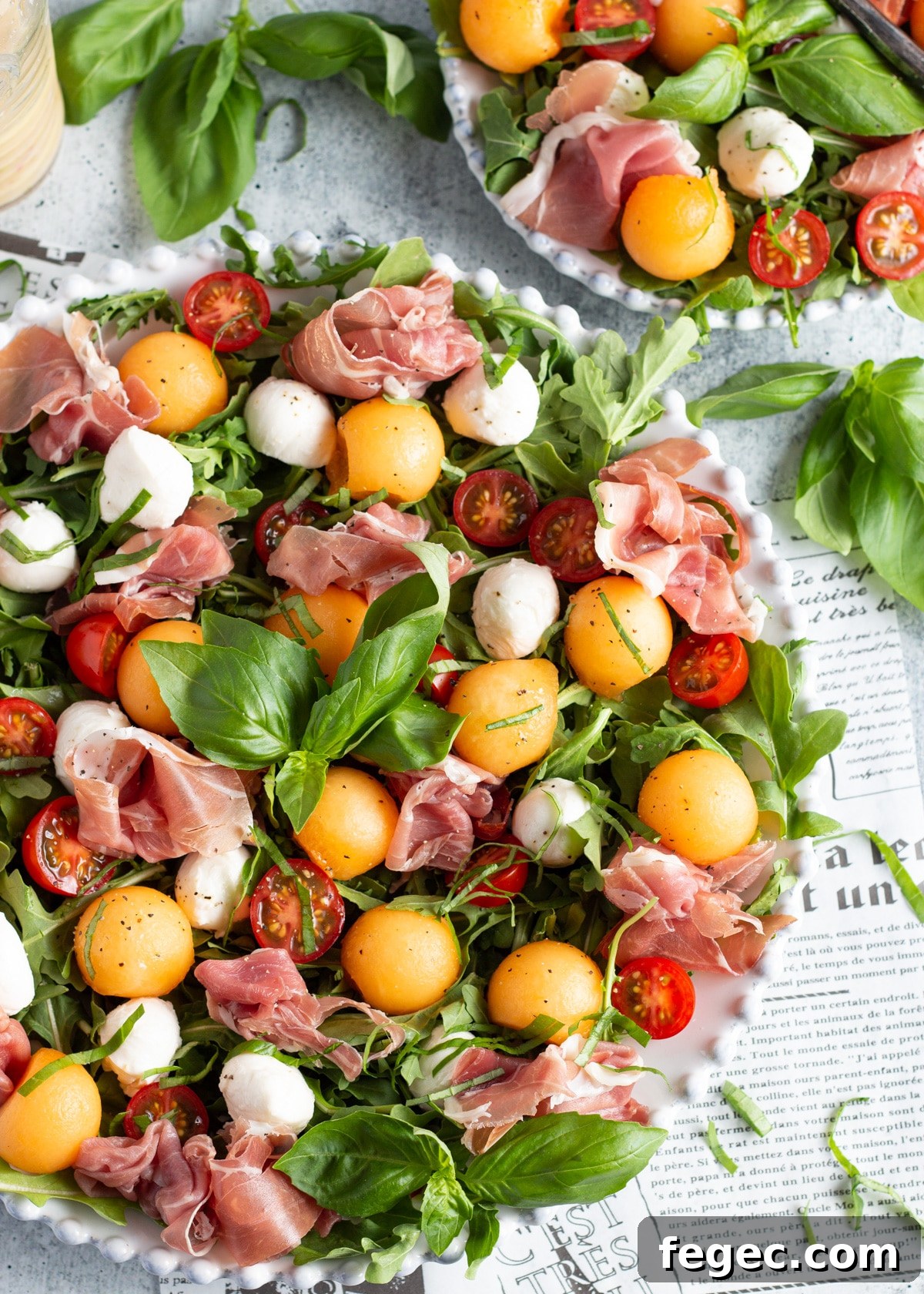 Photo of the prosciutto melon caprese salad in a platter.