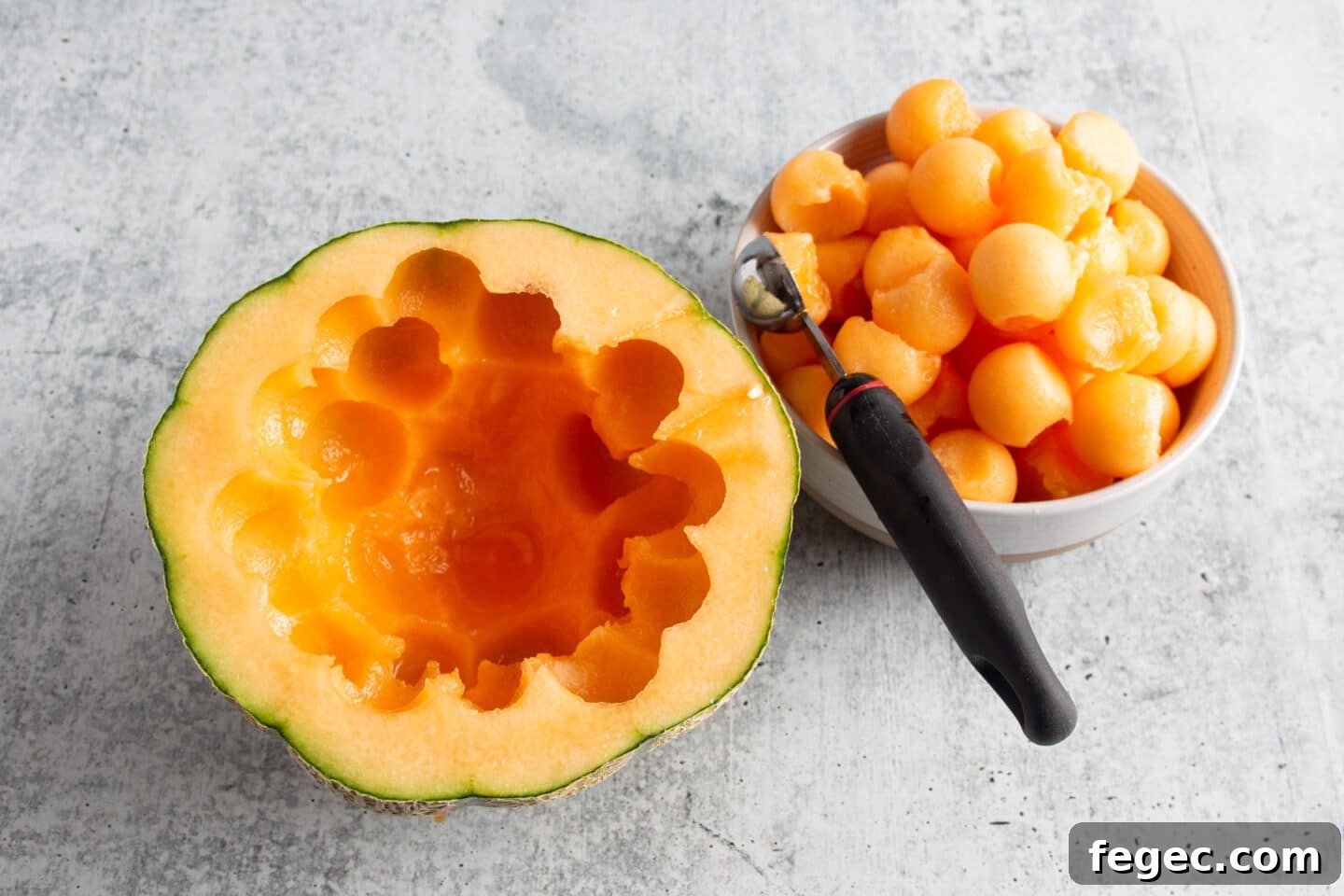 This is a picture of the melon being cut into balls.