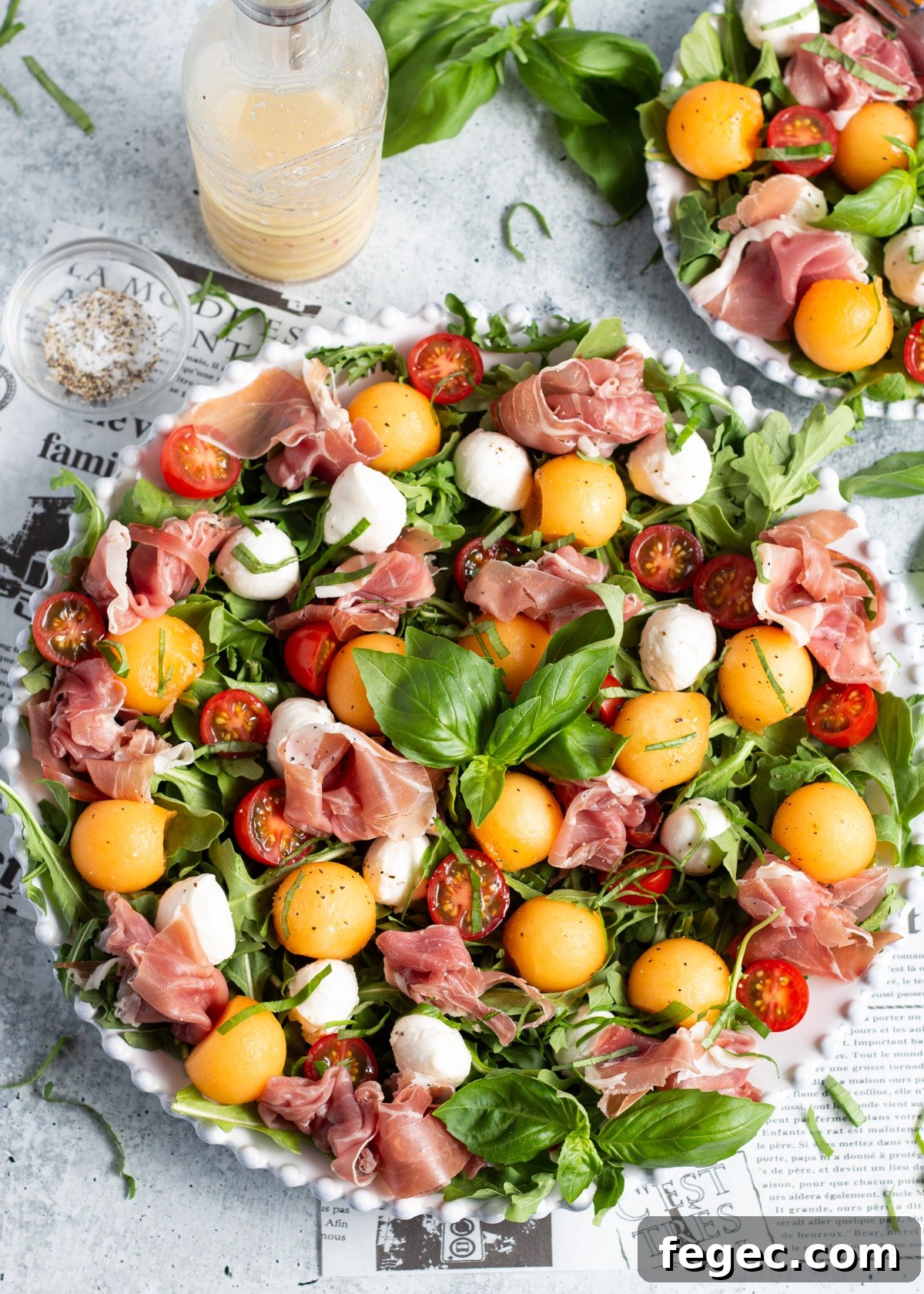 Photo of the prosciutto melon caprese salad in a platter.