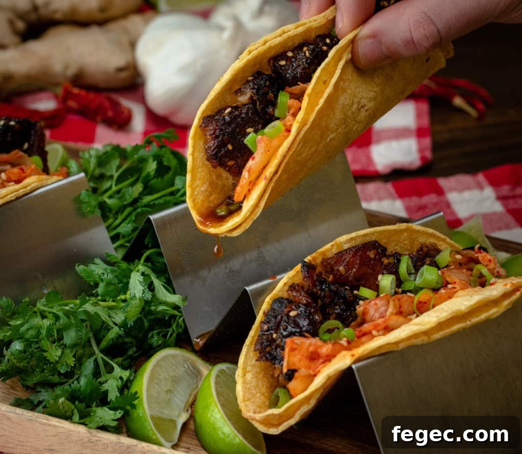 Plated pork belly tacos