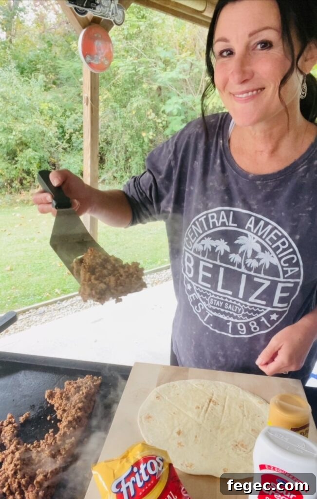 adding ground taco meat to tortillas