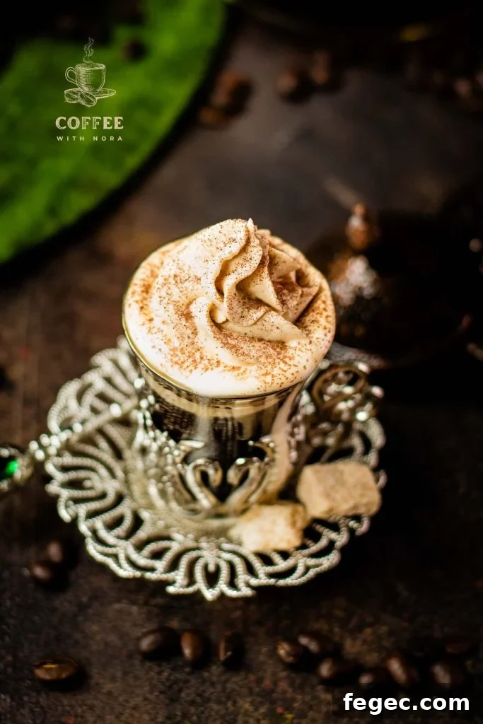 Beautiful pumpkin flavored whipped cream piped on black coffee.