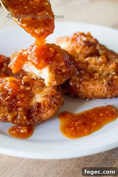 Juicy chicken strips or chicken tenders recipe on a plate 