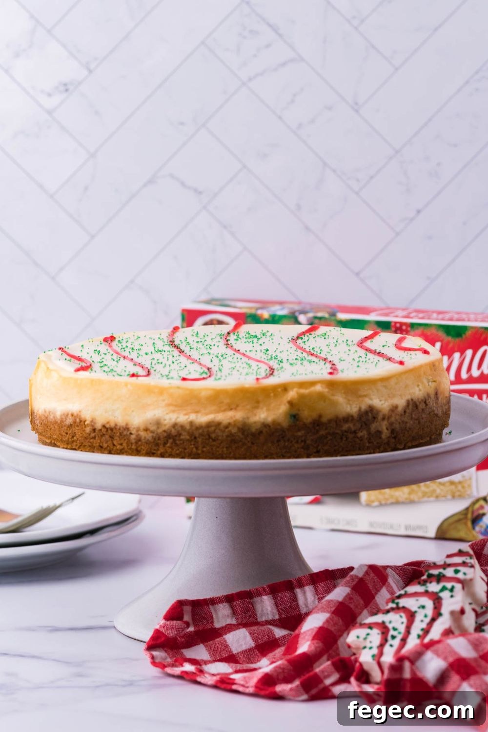 cheesecake on a cake stand on table 