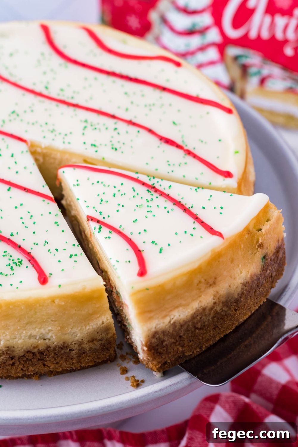 taking a slice of cheesecake out of platter 
