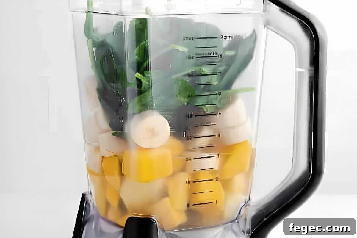 Island Green Tropical Smoothie Recipe for Refreshing Energy 8 Smoothie ingredients in a blender.