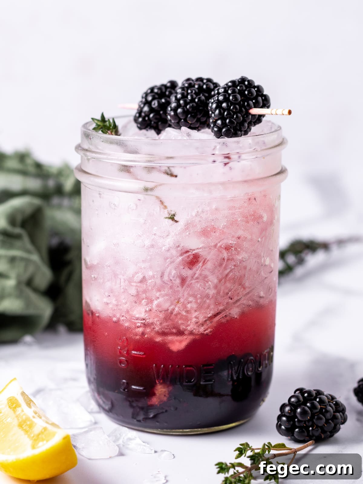 Refreshing Blackberry Smash Mocktail Recipe 8 unmixed blackberry mocktail in mason jar
