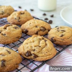chocolate chip cookies on black wire rack.
