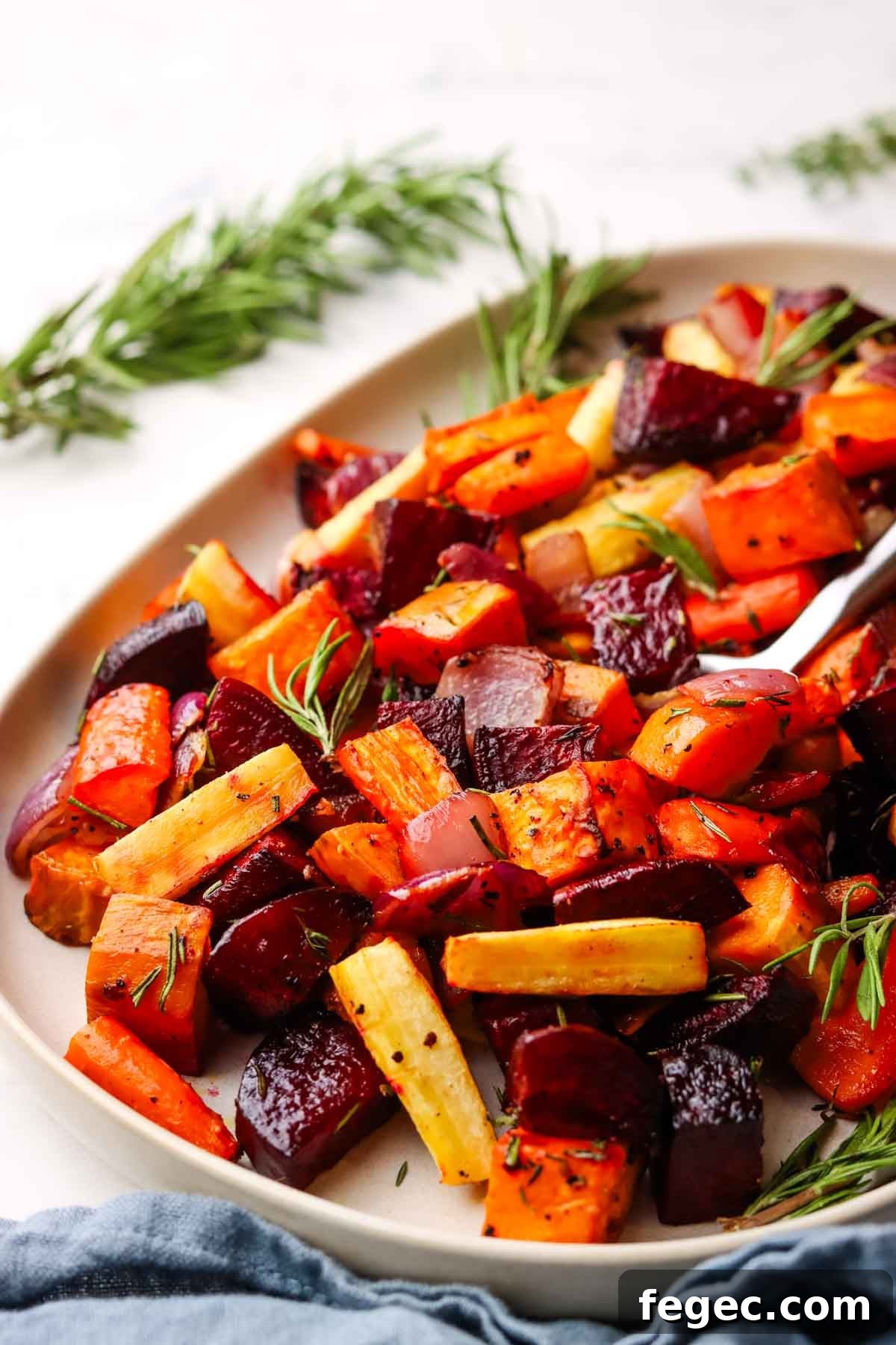 a bowl of roasted root veggies in a serving bowl