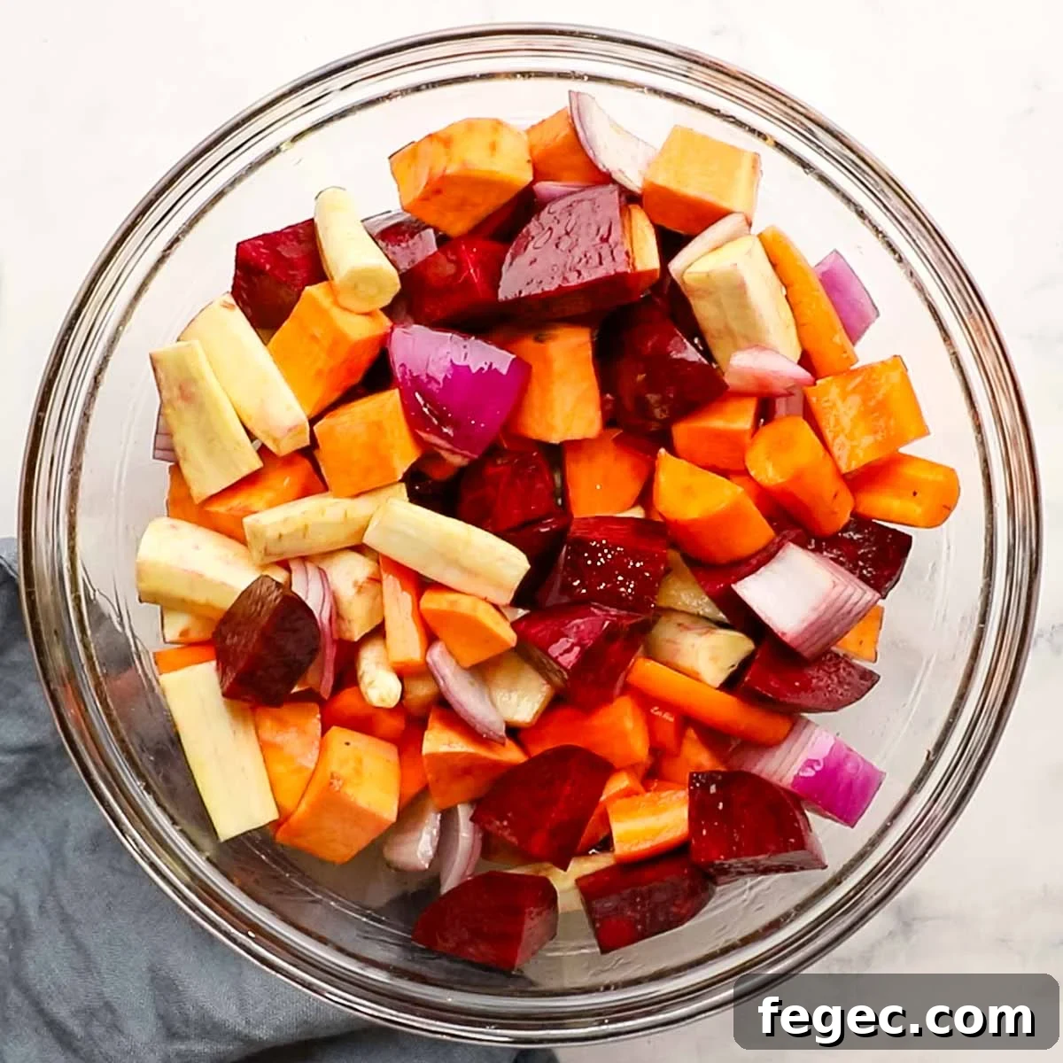 different root veggies cut up in a large bowl