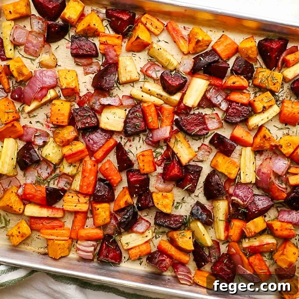 overhead view of roasted root veggies in a baking sheet