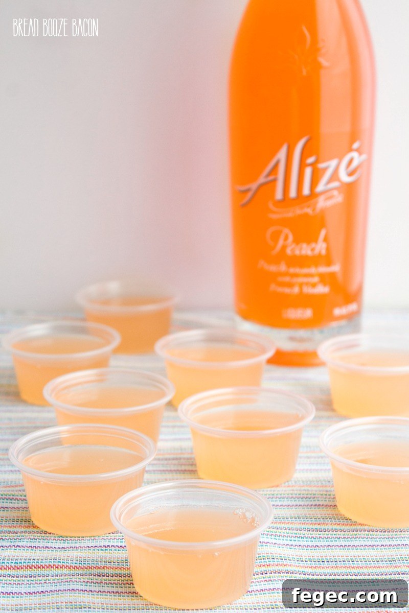 Peach Fizz Jello Shots are about to become your go-to summer cocktail! Super easy to make and crazy good, these shots disappear in a flash!
