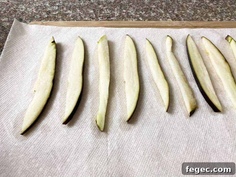 wet Eggplant slices on paper towel