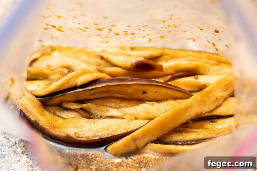 Eggplant slices in marinade in ziplock bag