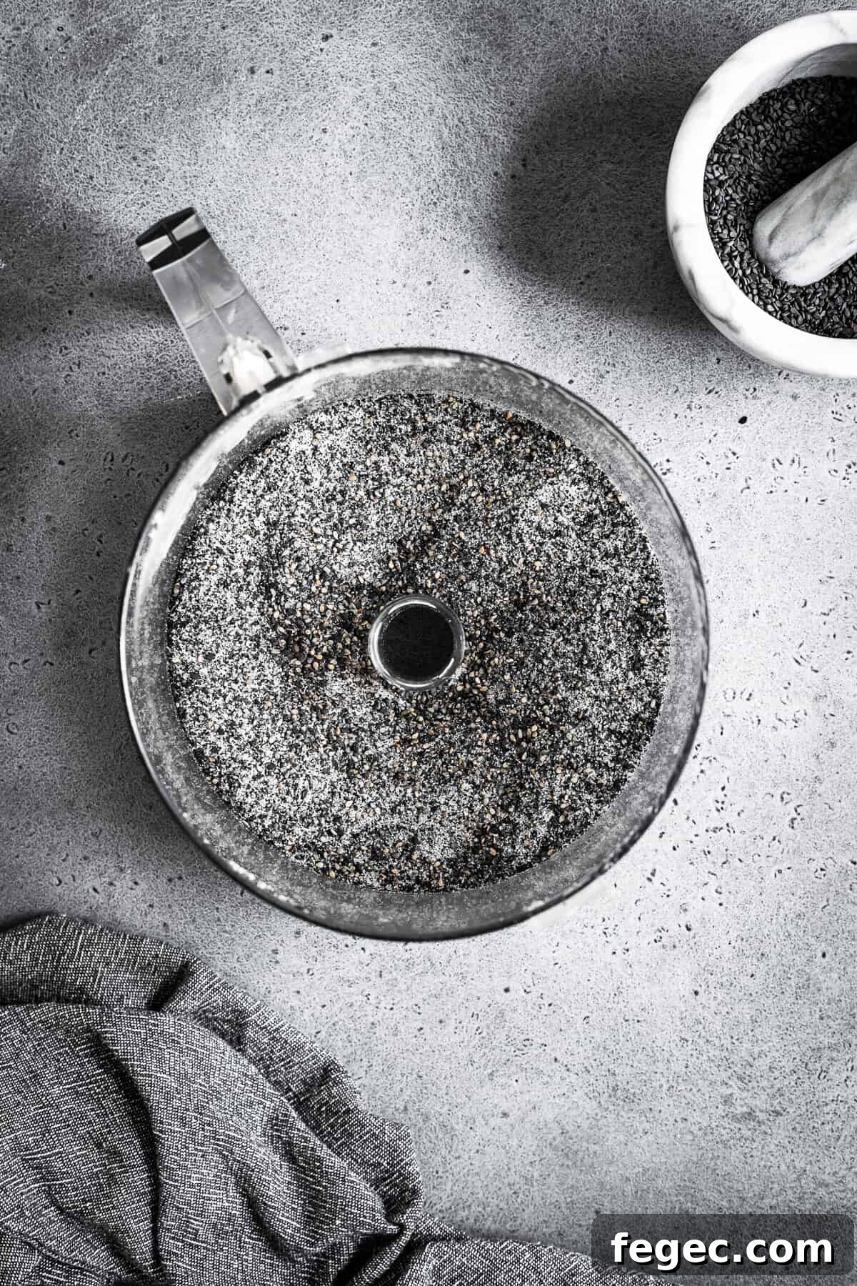 Ground black sesame seeds in a food processor.