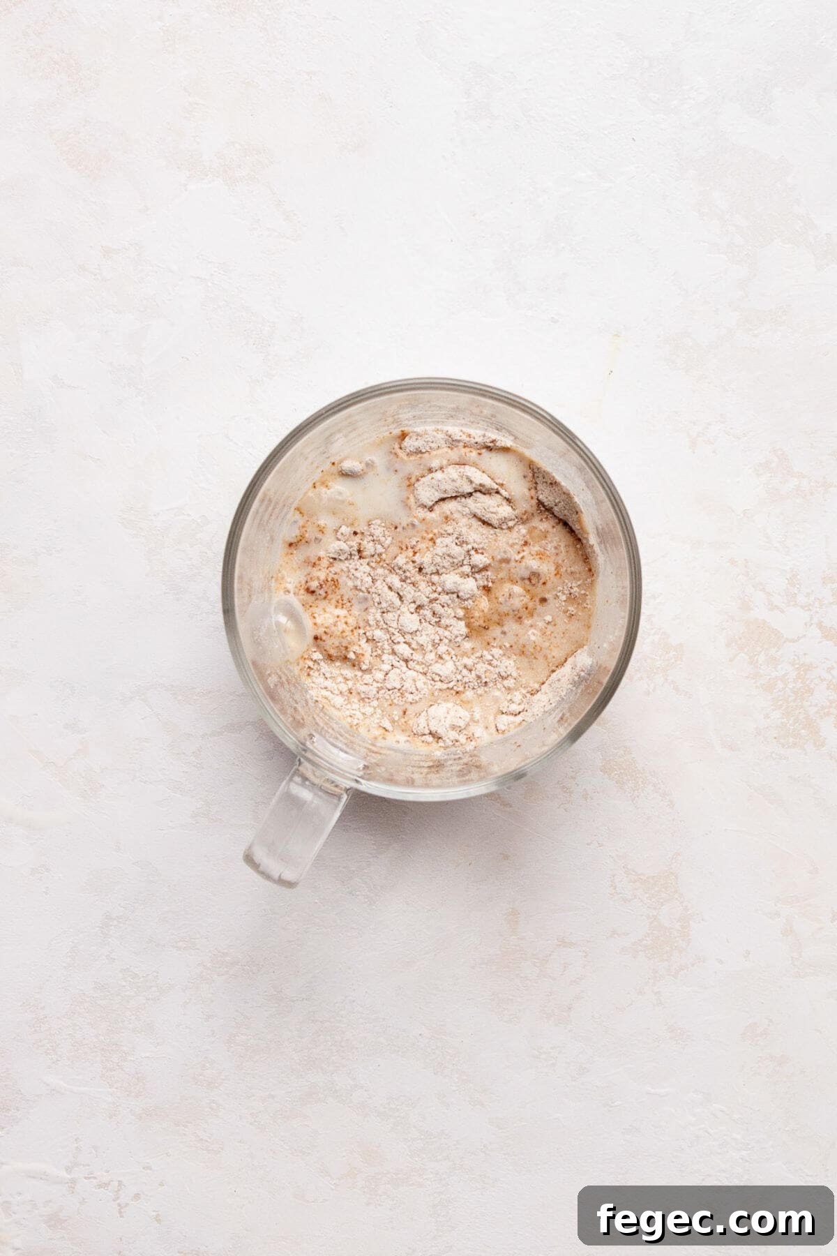 Protein Powder Mug Cake Recipe: Quick High-Protein Dessert in Minutes 4 Mixing the dry ingredients with the wet ingredients in a mug.