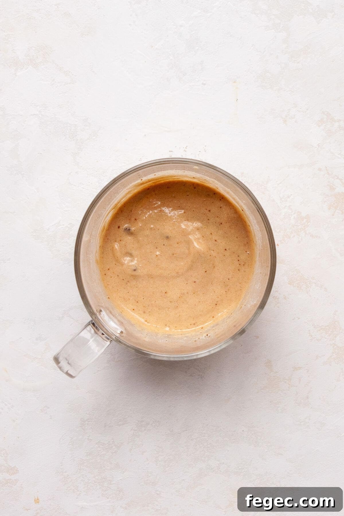 Protein Powder Mug Cake Recipe: Quick High-Protein Dessert in Minutes 5 Protein mug cake batter in a glass mug before microwaving.