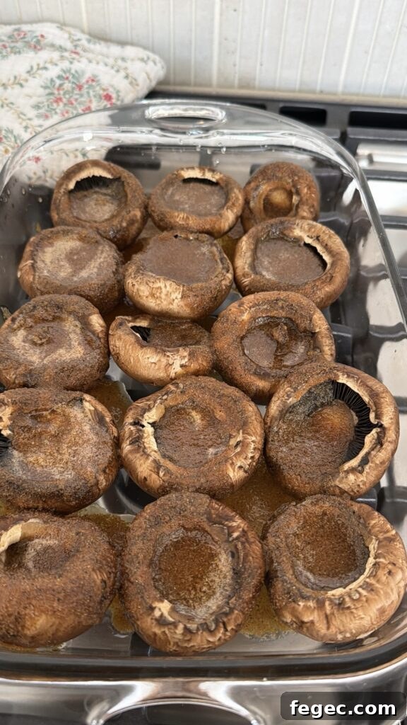 Steakhouse Garlic Butter Marinated Grilled Mushrooms 4 The mushroom caps topped with marinade before baking