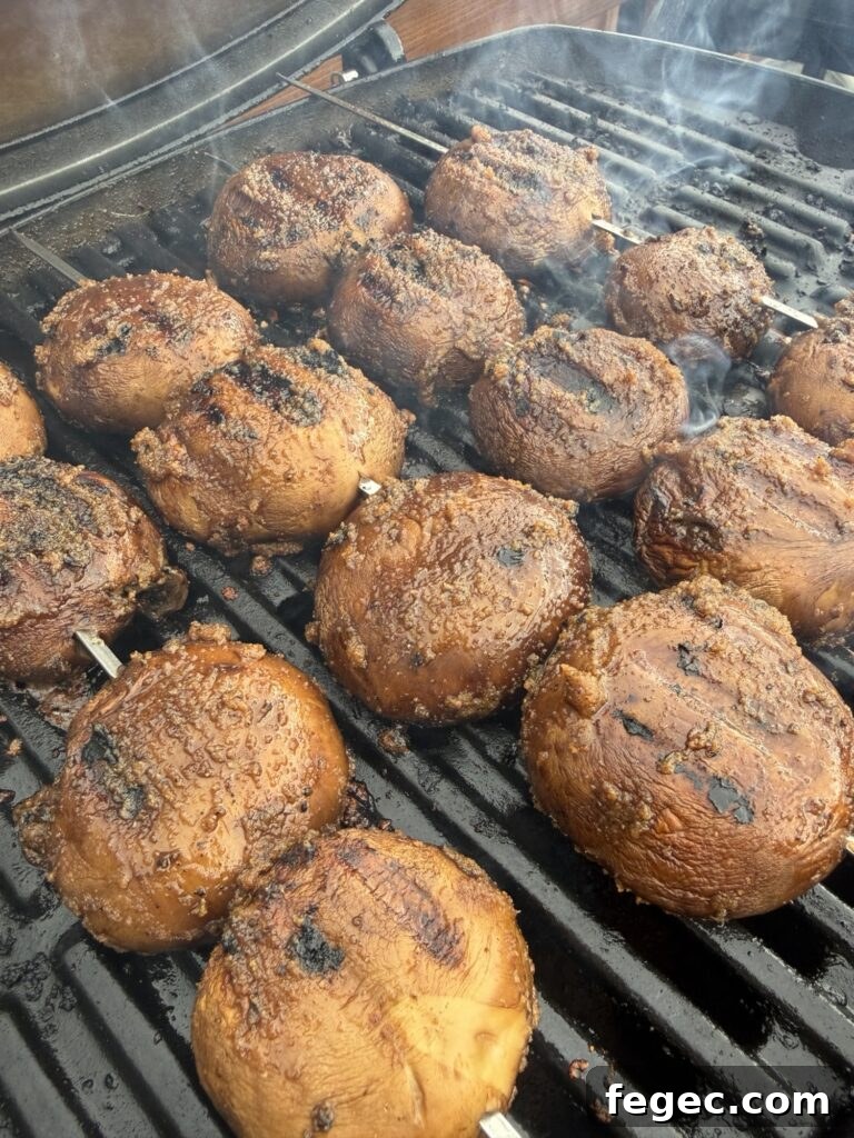 Steakhouse Garlic Butter Marinated Grilled Mushrooms 6 The mushrooms on the grill