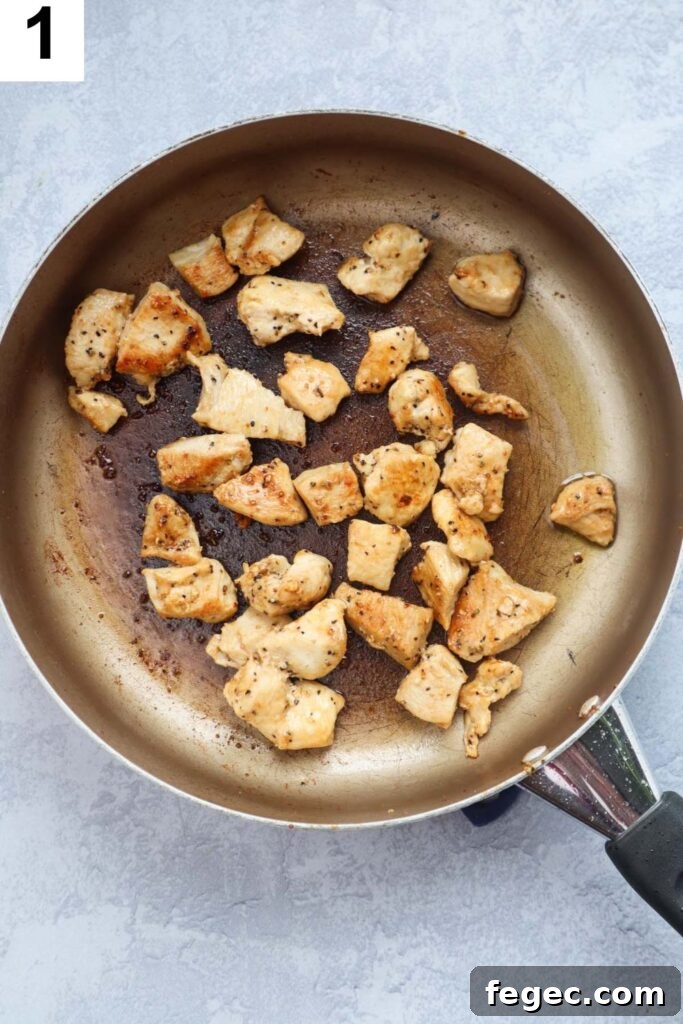 sauteed cooked and seasoned chicken breasts in skillet