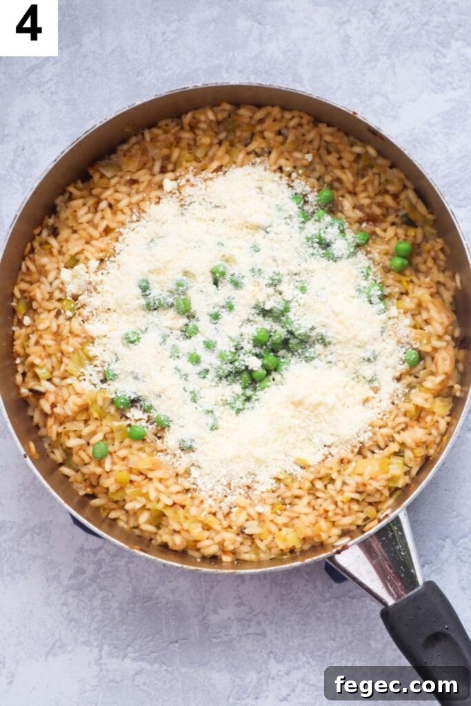 cooked arborio rice with parmesan cheese and frozen peas