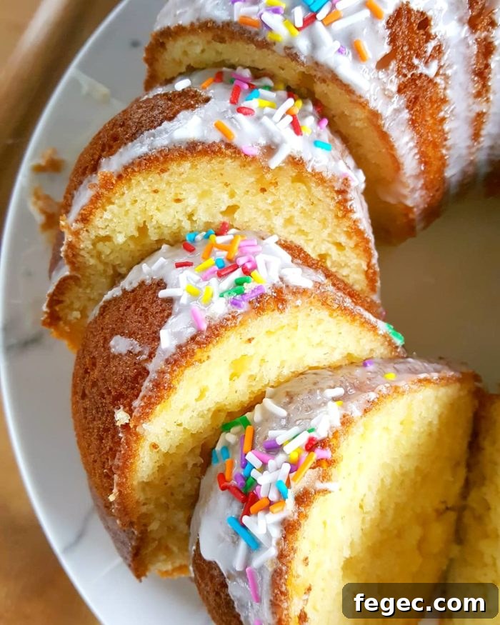 Vanilla Pudding Sour Cream Bundt Cake (Boxed Mix) - Doctored cake mix bundt cake made with sour cream and vanilla pudding. This cake comes out so soft and moist every single time and it tastes like it's homemade! | Beat Bake Eat