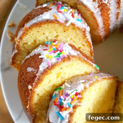 Vanilla Pudding Sour Cream Bundt Cake (Boxed Mix) - Doctored cake mix bundt cake made with sour cream and vanilla pudding. This cake comes out so soft and moist every single time and it tastes like it's homemade! | Beat Bake Eat