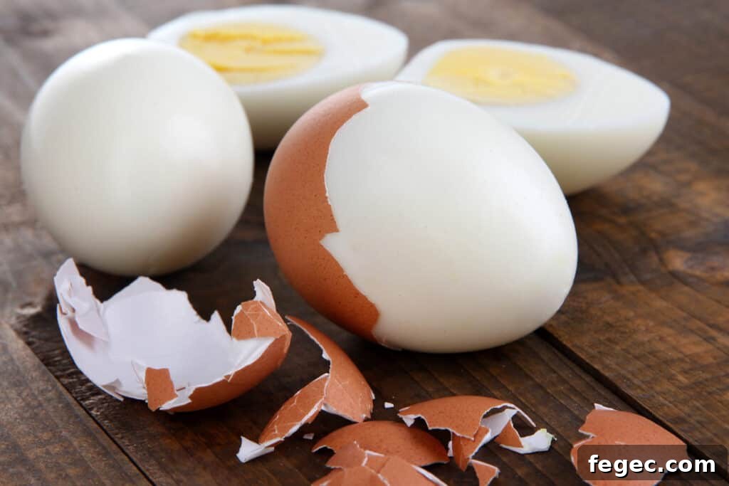 A hard boiled egg being peeled. Baking soda hard boiled eggs. Perfect hard boiled eggs.