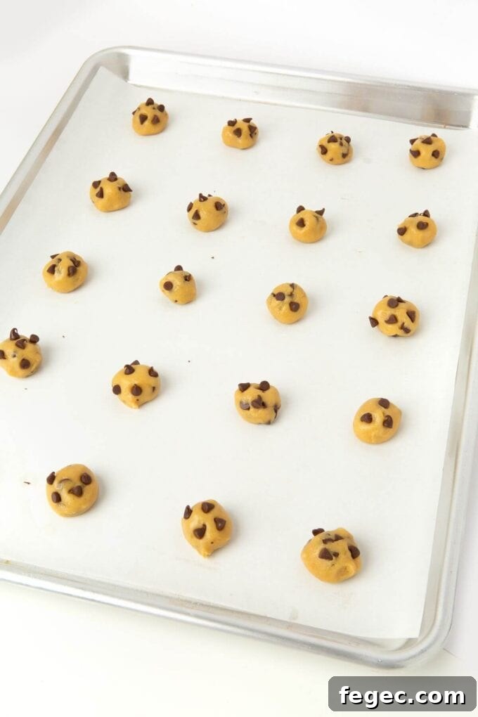 cookie dough balls on baking sheet