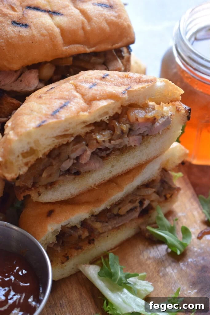 Close up of steak and onion sandwiches.