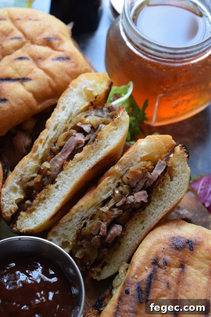 Shaved steak sandwiches with onions.