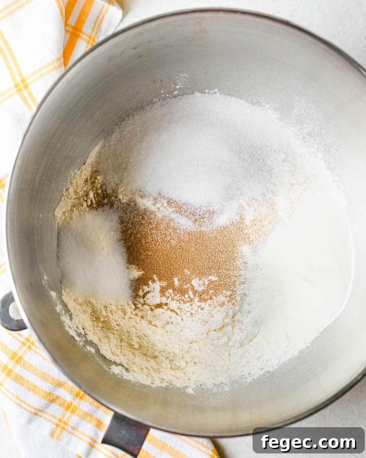 Mixing the dry ingredients for the cinnamon roll dough.