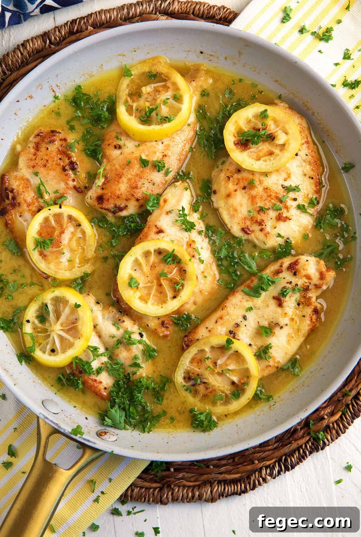 Lemon pepper chicken is in a skillet.