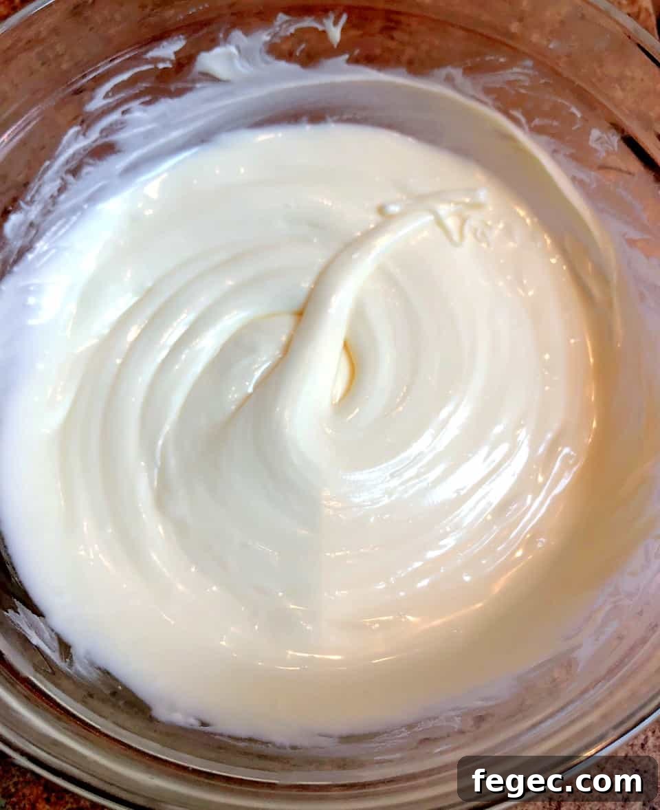 Perfect Cake Balls: Simple No-Bake Party Treats 7 candy coating melted in a bowl.