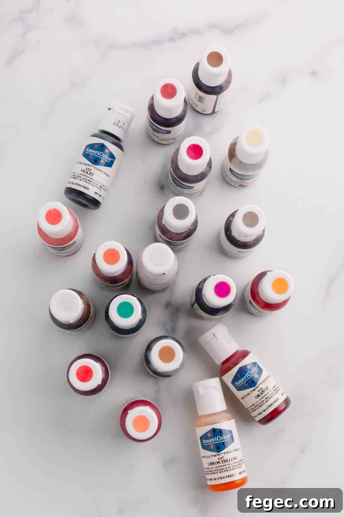 Food Coloring Guide: Uses, Tips, and Safety Essentials 2 About 20 colorful Americolor brand gel food colorings on a marble background.