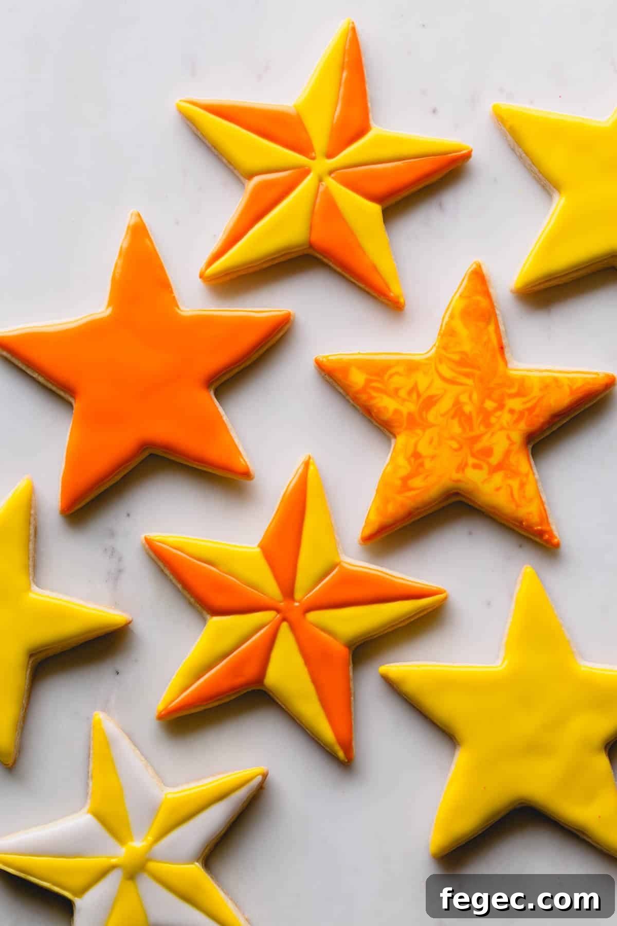Food Coloring Guide: Uses, Tips, and Safety Essentials 4 Yellow and orange star sugar cookies on a white background.